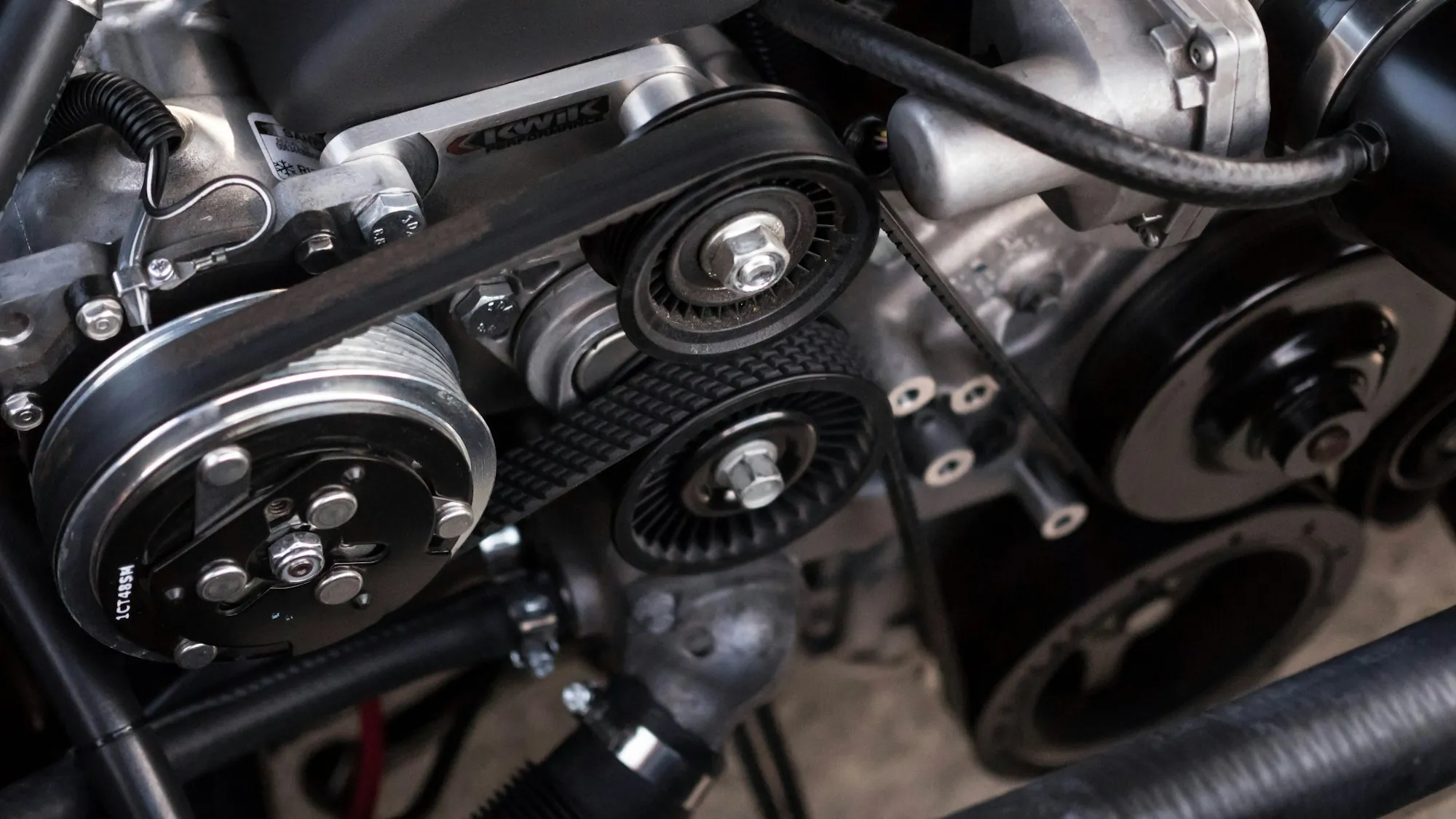 Serpentine belt and pulleys on the front of an engine